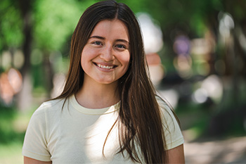 A smiling student outside