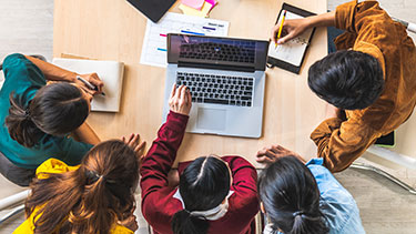 Students working indoors at a table