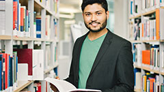 Student reading in the library