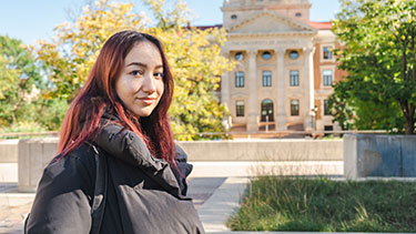 Student standing outside on the University of Manitoba campus