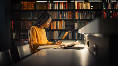 Student studying in a library