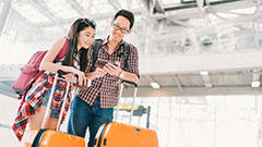 Students travelling through an airport