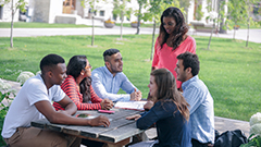 Group of students at a picnic table